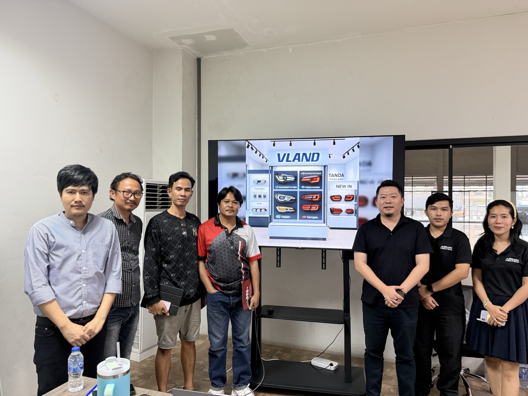 The Service Center team with Thai customers at the showroom